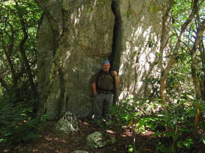 The Ol' Cracked Boulder-Rock
Rat Patrol stands in front of the huge, uplifted, split boulder.  Coldspring Mountain,
September, 2010
